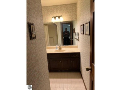 This home in the attractive Michabou Shores Subdivision is about on Crystal Downs Country Club in Michigan - for sale on GolfHomes.com, golf home, golf lot
