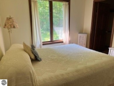 This home in the attractive Michabou Shores Subdivision is about on Crystal Downs Country Club in Michigan - for sale on GolfHomes.com, golf home, golf lot