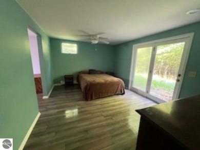 This home in the attractive Michabou Shores Subdivision is about on Crystal Downs Country Club in Michigan - for sale on GolfHomes.com, golf home, golf lot
