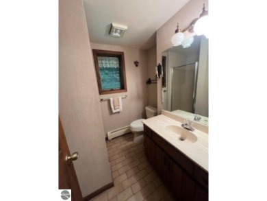 This home in the attractive Michabou Shores Subdivision is about on Crystal Downs Country Club in Michigan - for sale on GolfHomes.com, golf home, golf lot