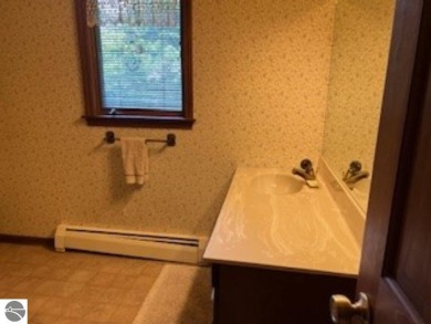 This home in the attractive Michabou Shores Subdivision is about on Crystal Downs Country Club in Michigan - for sale on GolfHomes.com, golf home, golf lot