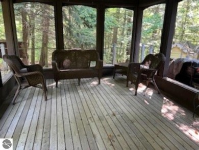 This home in the attractive Michabou Shores Subdivision is about on Crystal Downs Country Club in Michigan - for sale on GolfHomes.com, golf home, golf lot