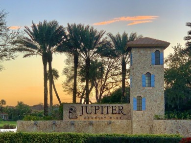 This highly upgraded carriage home in Jupiter Country Club on Jupiter Country Club in Florida - for sale on GolfHomes.com, golf home, golf lot