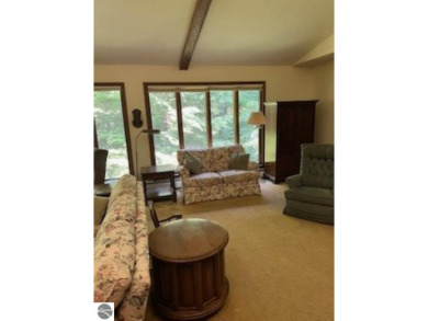 This home in the attractive Michabou Shores Subdivision is about on Crystal Downs Country Club in Michigan - for sale on GolfHomes.com, golf home, golf lot