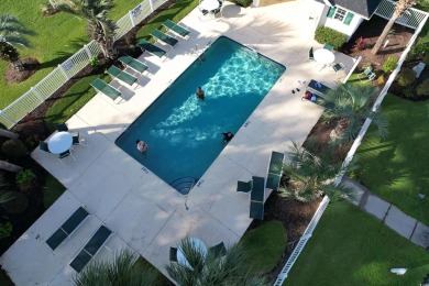 This immaculate 2nd-floor condo in the highly sought-after River on River Oaks Golf Plantation  in South Carolina - for sale on GolfHomes.com, golf home, golf lot