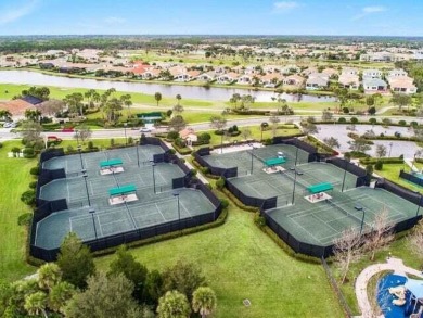 This highly upgraded carriage home in Jupiter Country Club on Jupiter Country Club in Florida - for sale on GolfHomes.com, golf home, golf lot