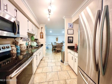 Updated End Unit Townhome with additional heated/cooled sq on Diamondhead Country Club in Mississippi - for sale on GolfHomes.com, golf home, golf lot