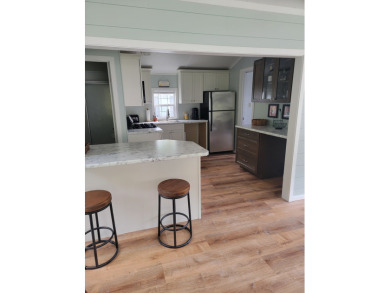This two bedroom, 1.5 half bath Park Model is located in highly on Point Sebago Golf/Beach Resort in Maine - for sale on GolfHomes.com, golf home, golf lot