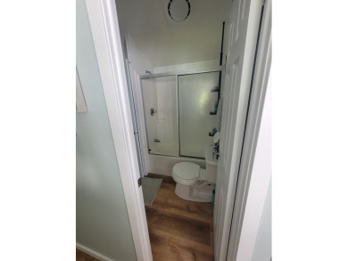 This two bedroom, 1.5 half bath Park Model is located in highly on Point Sebago Golf/Beach Resort in Maine - for sale on GolfHomes.com, golf home, golf lot