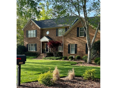 Beautiful brick-front traditional home located on the 7th hole on Williamsburg National Golf Club in Virginia - for sale on GolfHomes.com, golf home, golf lot