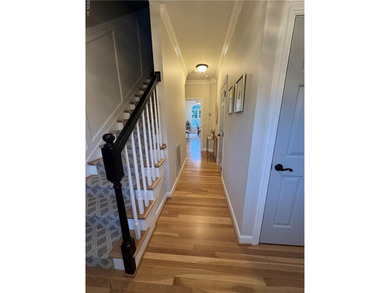 Beautiful brick-front traditional home located on the 7th hole on Williamsburg National Golf Club in Virginia - for sale on GolfHomes.com, golf home, golf lot