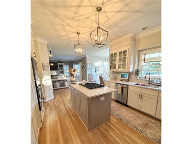 Beautiful brick-front traditional home located on the 7th hole on Williamsburg National Golf Club in Virginia - for sale on GolfHomes.com, golf home, golf lot