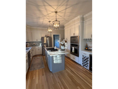 Beautiful brick-front traditional home located on the 7th hole on Williamsburg National Golf Club in Virginia - for sale on GolfHomes.com, golf home, golf lot