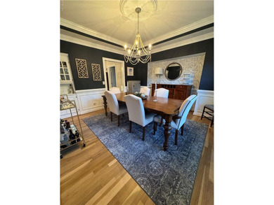 Beautiful brick-front traditional home located on the 7th hole on Williamsburg National Golf Club in Virginia - for sale on GolfHomes.com, golf home, golf lot