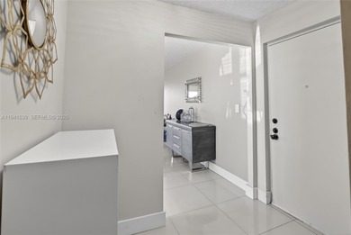 **SPACIOUS AND BRIGHT 3/2 - BEAUTIFULLY RENOVATED WITH A MODERN on Inverrary Country Club in Florida - for sale on GolfHomes.com, golf home, golf lot