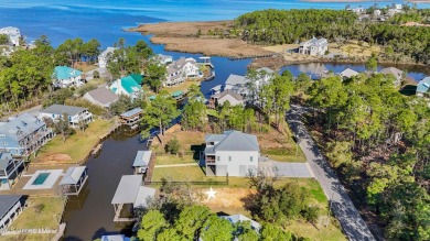 Enjoy this beautiful waterfront lot while planning your dream on Pass Christian Isles Golf Club in Mississippi - for sale on GolfHomes.com, golf home, golf lot