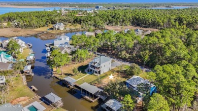 Enjoy this beautiful waterfront lot while planning your dream on Pass Christian Isles Golf Club in Mississippi - for sale on GolfHomes.com, golf home, golf lot