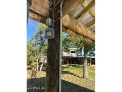 Enjoy this beautiful waterfront lot while planning your dream on Pass Christian Isles Golf Club in Mississippi - for sale on GolfHomes.com, golf home, golf lot