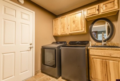 Beautifully updated 4 bedroom, 2 bathroom home in Village Green on Twin Lakes Golf Club in Arkansas - for sale on GolfHomes.com, golf home, golf lot