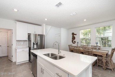 Better than new! Waterfront! This 4/2.5 stunning home with a on LPGA International Golf Course in Florida - for sale on GolfHomes.com, golf home, golf lot