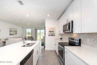 Better than new! Waterfront! This 4/2.5 stunning home with a on LPGA International Golf Course in Florida - for sale on GolfHomes.com, golf home, golf lot