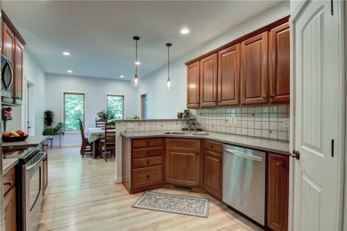 Beautifully maintained home sits on a spacious .69-acre lot on Menomonie Country Club in Wisconsin - for sale on GolfHomes.com, golf home, golf lot