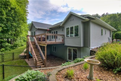 Beautifully maintained home sits on a spacious .69-acre lot on Menomonie Country Club in Wisconsin - for sale on GolfHomes.com, golf home, golf lot