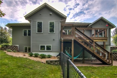 Beautifully maintained home sits on a spacious .69-acre lot on Menomonie Country Club in Wisconsin - for sale on GolfHomes.com, golf home, golf lot