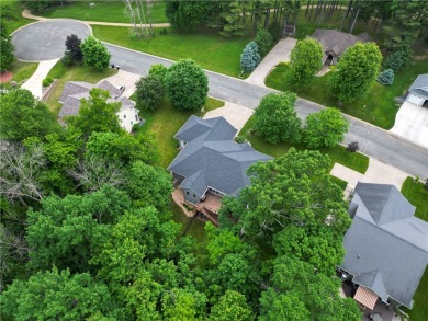 Beautifully maintained home sits on a spacious .69-acre lot on Menomonie Country Club in Wisconsin - for sale on GolfHomes.com, golf home, golf lot