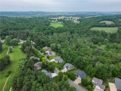 Beautifully maintained home sits on a spacious .69-acre lot on Menomonie Country Club in Wisconsin - for sale on GolfHomes.com, golf home, golf lot