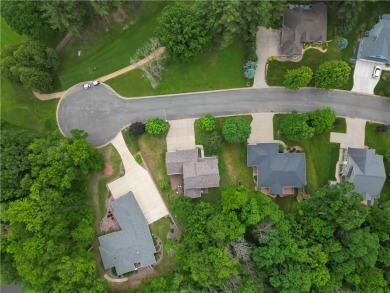 Beautifully maintained home sits on a spacious .69-acre lot on Menomonie Country Club in Wisconsin - for sale on GolfHomes.com, golf home, golf lot