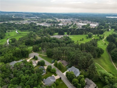 Beautifully maintained home sits on a spacious .69-acre lot on Menomonie Country Club in Wisconsin - for sale on GolfHomes.com, golf home, golf lot