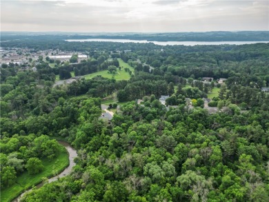 Beautifully maintained home sits on a spacious .69-acre lot on Menomonie Country Club in Wisconsin - for sale on GolfHomes.com, golf home, golf lot
