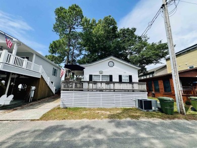 ADORABLE 2 BED/1.5 BATH BEACH HOUSE WITH WRAPAROUND COMPOSITE on Prestwick Country Club in South Carolina - for sale on GolfHomes.com, golf home, golf lot