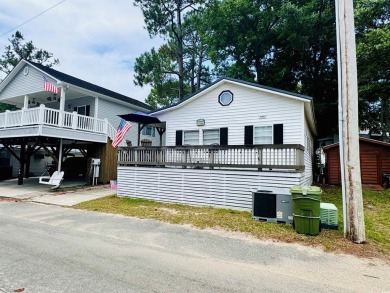 ADORABLE 2 BED/1.5 BATH BEACH HOUSE WITH WRAPAROUND COMPOSITE on Prestwick Country Club in South Carolina - for sale on GolfHomes.com, golf home, golf lot
