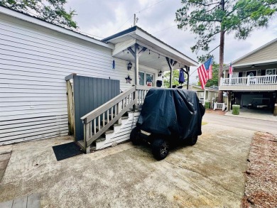 ADORABLE 2 BED/1.5 BATH BEACH HOUSE WITH WRAPAROUND COMPOSITE on Prestwick Country Club in South Carolina - for sale on GolfHomes.com, golf home, golf lot