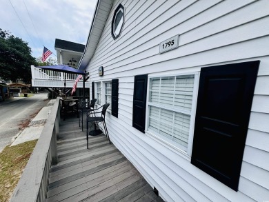 ADORABLE 2 BED/1.5 BATH BEACH HOUSE WITH WRAPAROUND COMPOSITE on Prestwick Country Club in South Carolina - for sale on GolfHomes.com, golf home, golf lot
