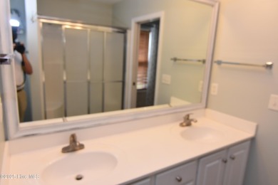 A Beautiful three bedroom, two bath home  with fenced back yard on Masonboro Country Club in North Carolina - for sale on GolfHomes.com, golf home, golf lot