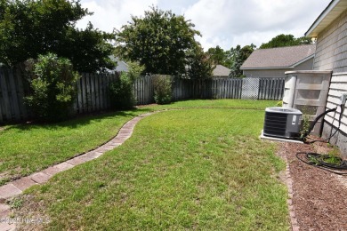 A Beautiful three bedroom, two bath home  with fenced back yard on Masonboro Country Club in North Carolina - for sale on GolfHomes.com, golf home, golf lot