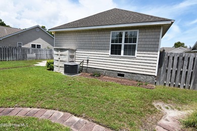 A Beautiful three bedroom, two bath home with fenced back yard on Masonboro Country Club in North Carolina - for sale on GolfHomes.com, golf home, golf lot