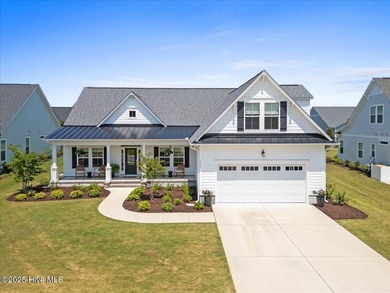 Experience exceptional coastal living at 429 Jackline Drive, a on Olde Point Golf and Country Club in North Carolina - for sale on GolfHomes.com, golf home, golf lot