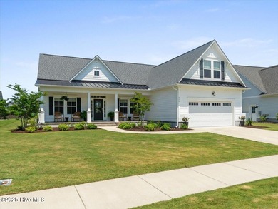 Experience exceptional coastal living at 429 Jackline Drive, a on Olde Point Golf and Country Club in North Carolina - for sale on GolfHomes.com, golf home, golf lot