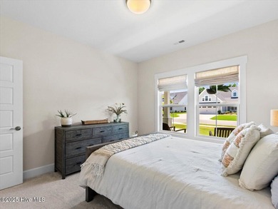 Experience exceptional coastal living at 429 Jackline Drive, a on Olde Point Golf and Country Club in North Carolina - for sale on GolfHomes.com, golf home, golf lot