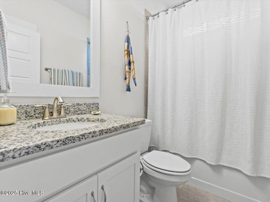 Experience exceptional coastal living at 429 Jackline Drive, a on Olde Point Golf and Country Club in North Carolina - for sale on GolfHomes.com, golf home, golf lot