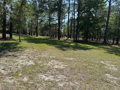 Build your dream home on this lightly wooded, ready-to-build lot on Ocean Ridge Plantation in North Carolina - for sale on GolfHomes.com, golf home, golf lot