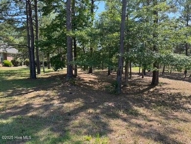 Build your dream home on this lightly wooded, ready-to-build lot on Ocean Ridge Plantation in North Carolina - for sale on GolfHomes.com, golf home, golf lot