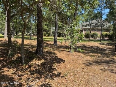 Build your dream home on this lightly wooded, ready-to-build lot on Ocean Ridge Plantation in North Carolina - for sale on GolfHomes.com, golf home, golf lot