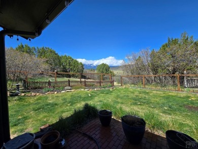 Experience the most spectacular mountain views in the area from on Hollydot Golf Course in Colorado - for sale on GolfHomes.com, golf home, golf lot