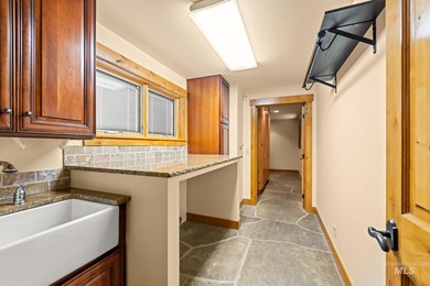 Experience the perfect fusion of classic log craftsmanship and on McCall Municipal Golf Course in Idaho - for sale on GolfHomes.com, golf home, golf lot