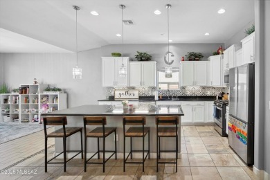 This single-story home in the gated Omni Tucson National resort on Omni Tucson National Golf Resort and Spa - Sonoran in Arizona - for sale on GolfHomes.com, golf home, golf lot